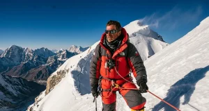 Mount Everest Climbing Gear Rent vs Buy What Wins Climber in an 8000m down suit on a fixed line, full Mount Everest climbing gear in real use