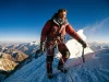 7,563 People Have Climbed Everest — Who They Are Roped climber high on a snowy Everest summit ridge at dawn, the kind of climb on the list of people who climbed Everest