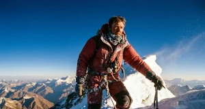 7,563 People Have Climbed Everest — Who They Are Roped climber high on a snowy Everest summit ridge at dawn, the kind of climb on the list of people who climbed Everest