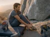 Best Climbing Shoes for Bouldering Without the Foot Pain Boulderer pulling on La Sportiva Skwama shoes on a crash pad before a last attempt at dusk
