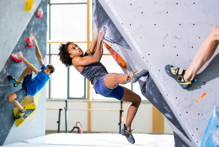 Composite image demystifying advanced bouldering moves: a central dyno, with clear examples of a heel hook and a toe hook, for a comprehensive analysis.