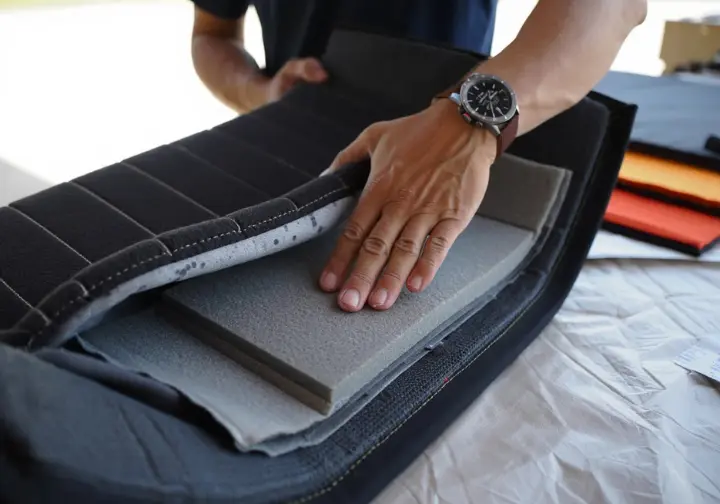 Detailed view of an open bouldering crash pad showing its foam layers and durable shell, explaining crash pad anatomy and what makes a great pad.