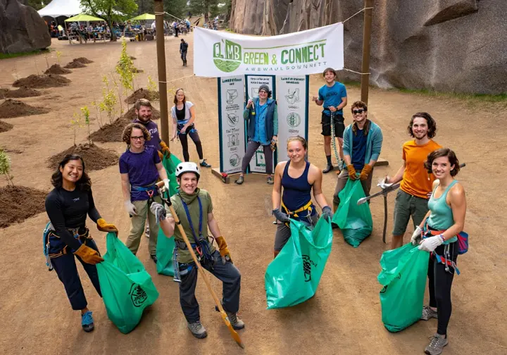 Diverse climbers participate in a sustainability workshop and trail clean-up at a festival, showing the evolving spirit of culture, community, and sustainability.