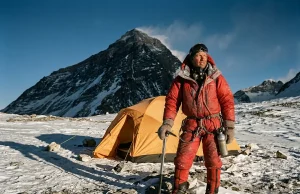 Camp 4 on Everest Isn’t for Resting, It’s for Waiting Climber in a red down suit on Everest's Camp 4 on the South Col at dusk