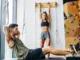 Core & Grip: A Climber’s Gym Workout Plan Diverse climbers performing core and grip exercises in a modern gym, illustrating a comprehensive gym workout plan for climbers.