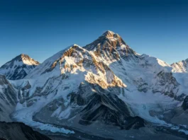 A photorealistic image of Mount Everest, the world's highest peak, viewed from a distance, highlighting its location on the border of Nepal and Tibet.