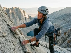 Why the East Face of Mt Whitney Isn’t Really 5.7 Climber on the exposed granite of the East Face of Mt Whitney at first light