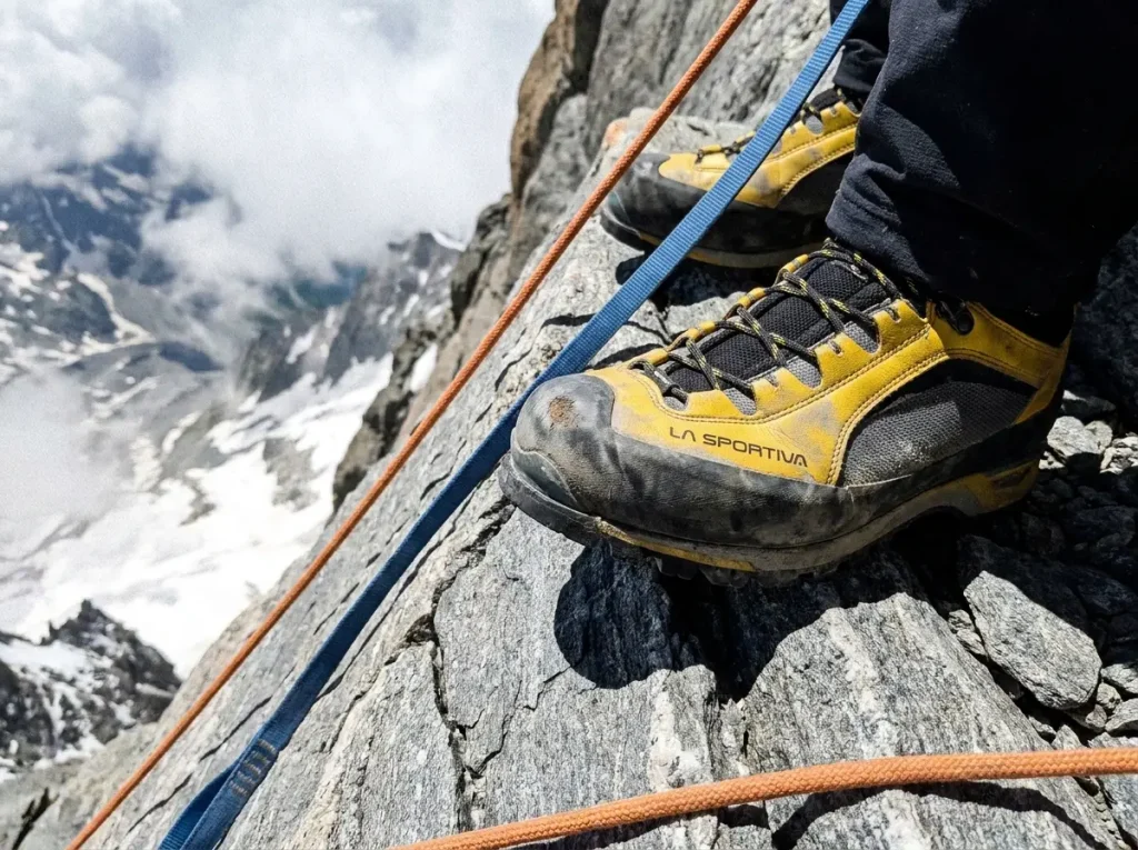 Climber's stiff alpine boots edging on exposed grade III rock on the Matterhorn