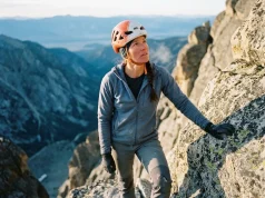 Why Fit Climbers Still Fail on the Grand Teton Climber on the Grand Teton's upper granite at dawn in a Petzl helmet, Grand Teton climbing guide