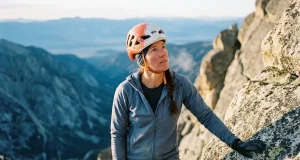 Why Fit Climbers Still Fail on the Grand Teton Climber on the Grand Teton's upper granite at dawn in a Petzl helmet, Grand Teton climbing guide