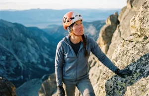 Why Fit Climbers Still Fail on the Grand Teton Climber on the Grand Teton's upper granite at dawn in a Petzl helmet, Grand Teton climbing guide