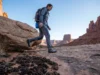 Don’t Bust the Crust: Cryptobiotic Soil Rules Every Climber Needs Climber carefully stepping on slickrock to avoid cryptobiotic soil crust at Indian Creek