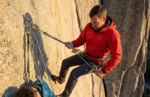 Counterbalance Rappel Rescue for Multi-Pitch Routes Climber performing counterbalance rappel rescue on multi-pitch granite route with unconscious partner