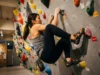 Tokyo Climbing Gyms Setting Style Decoded: The Katsu Method Japanese climber executing small box compression move in Tokyo climbing gym setting style