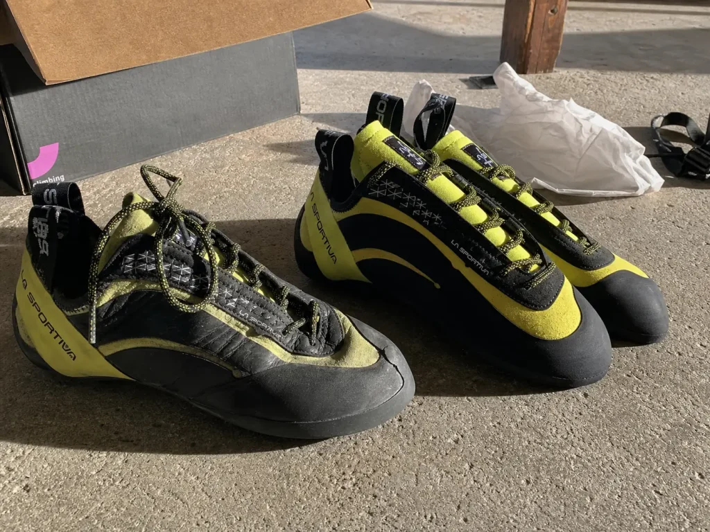 A freshly resoled climbing shoe next to a brand new pair, comparing the cost of resoling versus replacing