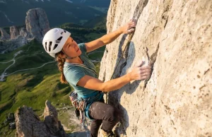 Climbing in the Dolomites? Here’s the Beta You Actually Need Climber leading a multi-pitch limestone route on Cinque Torri in the Italian Dolomites at golden hour