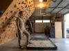 From Random Holds to Real Routes on Your Home Wall Climber assessing a home wall covered in colorful holds before setting new routes