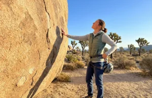 Do You Need a Permit to Climb Joshua Tree? Probably Not Climber preparing to ascend monzogranite at Joshua Tree National Park