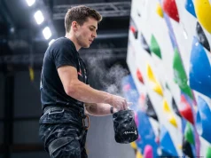 Stop Winging Your Local Comp. Train Like This Climber chalking up before a local gym bouldering competition — comp training preparation