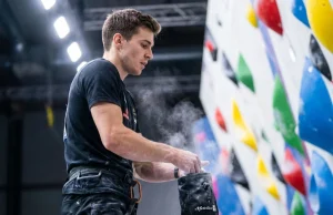 Stop Winging Your Local Comp. Train Like This Climber chalking up before a local gym bouldering competition — comp training preparation