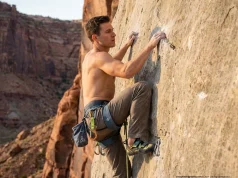 The Lock Off Strength Fix Most Climbers Never Try Climber executing a lock-off strength technique on a steep limestone sport route at golden hour