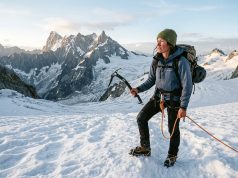 North Cascades Climbing the Guidebooks Get Wrong Climber on a North Cascades glacier at dawn, the range's peaks behind — North Cascades climbing guide