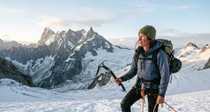 North Cascades Climbing the Guidebooks Get Wrong Climber on a North Cascades glacier at dawn, the range's peaks behind — North Cascades climbing guide