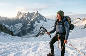 North Cascades Climbing the Guidebooks Get Wrong Climber on a North Cascades glacier at dawn, the range's peaks behind — North Cascades climbing guide