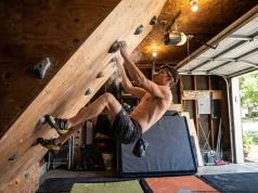 I Stole Tommy Caldwell’s Training Routine for 8 Weeks Climber training on steep home garage bouldering wall with chalk-dusted hands