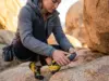 Sole Worn Through? Here’s the Exact Moment to Resole Climber examining worn climbing shoe rubber to determine if resole is needed