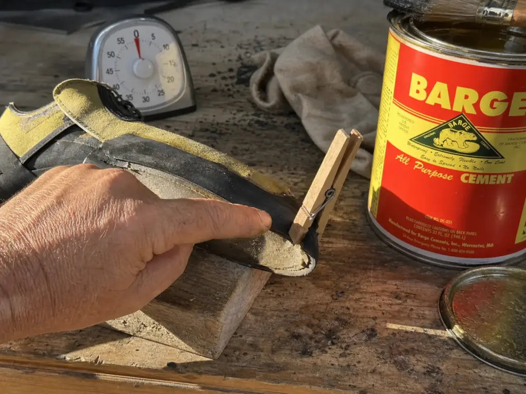 Testing contact cement for tack before pressing a climbing shoe rand, the step most DIY fixes skip