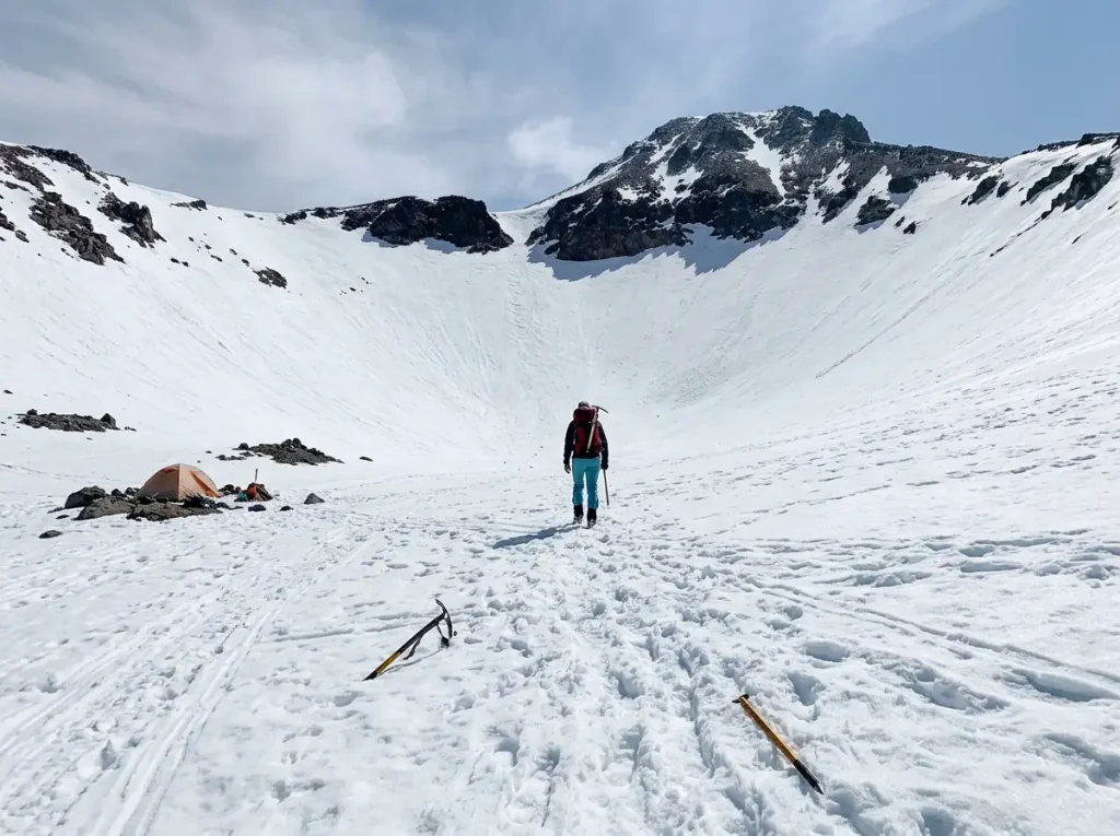 Wide view of Mount Shasta's Avalanche Gulch snow route rising above Helen Lake basin