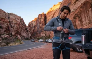 Best Climbing Near Major US Cities Ranked Climber racking up at Red Rock Canyon trailhead before dawn with the best climbing near Las Vegas