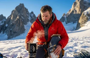Physics-Based Expedition Food Planning Calorie Calculator Alpinist using a JetBoil stove and expedition food planning calorie calculator at a snowy glacier basecamp at sunrise