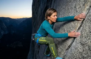 Lynn Hill Said “It Goes Boys” Then Proved It on The Nose Lynn Hill-style female climber on Yosemite granite big wall at dawn