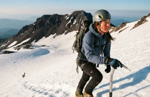 Do You Need a Guide for Mount Shasta? Maybe Not Climber kicking steps up firm snow on Mount Shasta's Avalanche Gulch at dawn with ice axe