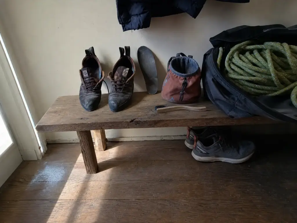 Climbing shoes airing out unclipped from a gear bag to dry properly after a session
