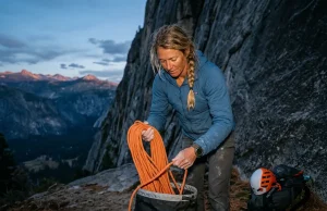 Campfire Rules at Climbing Areas That Close Crags Campfire rules at climbing areas explained: female climber protecting her rope from heat at the crag.