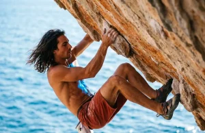Chris Sharma Deep Water Soloing Legacy As I Remember It Chris Sharma deep water soloing legacy hanging over the ocean.