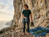 LA28 Olympic Climbing Format What Most Guides Miss Climber preparing for sport route with focused look