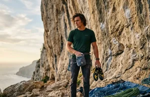 LA28 Olympic Climbing Format What Most Guides Miss Climber preparing for sport route with focused look