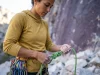 The Devils Lake Climbing Guide Wisconsin Locals Trust Female climber preparing gear at base of Devils Lake cliff