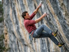 Why You’re Pumping Out — And How to Fix It Male rock climber with pumped forearms gripped on a steep limestone route to show how to build sport climbing endurance