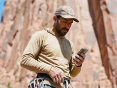 4 Mistakes That Ruin Indigenous Land Climbing Access Climber using smartphone app to check indigenous land climbing access respect guide boundaries