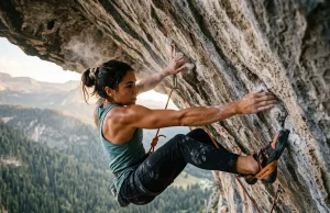 Feet Cutting on Roofs? Fix Your Body Position Female climbing an overhang with precise body positioning