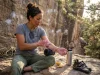 Why One Rest Day Never Fixed Your Climbing Fatigue Climber resting between sessions with nutrition and foam roller at outdoor crag