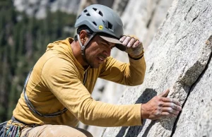 The 5-Step Rockfall Hazard Assessment For Climbers Climber doing a rockfall hazard assessment at a granite wall