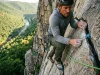 How to Climb Seneca Rocks WV Without Getting Sandbagged Climber placing a nut on seneca rocks climbing guide west virginia route