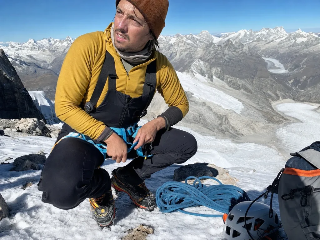 Climber roping up on a Cordillera Blanca lead-in peak like Pisco before attempting Huascaran — experience needed