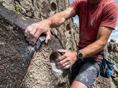 City of Rocks Idaho Climbing Guide for Every Level Climber ascending granite spire at City of Rocks Idaho at golden hour